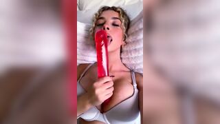 Kira Pregiato Teases With A Vibrant Red Dildo