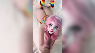 Belle Delphine Teases In Vibrant Rainbow Bodysuit
